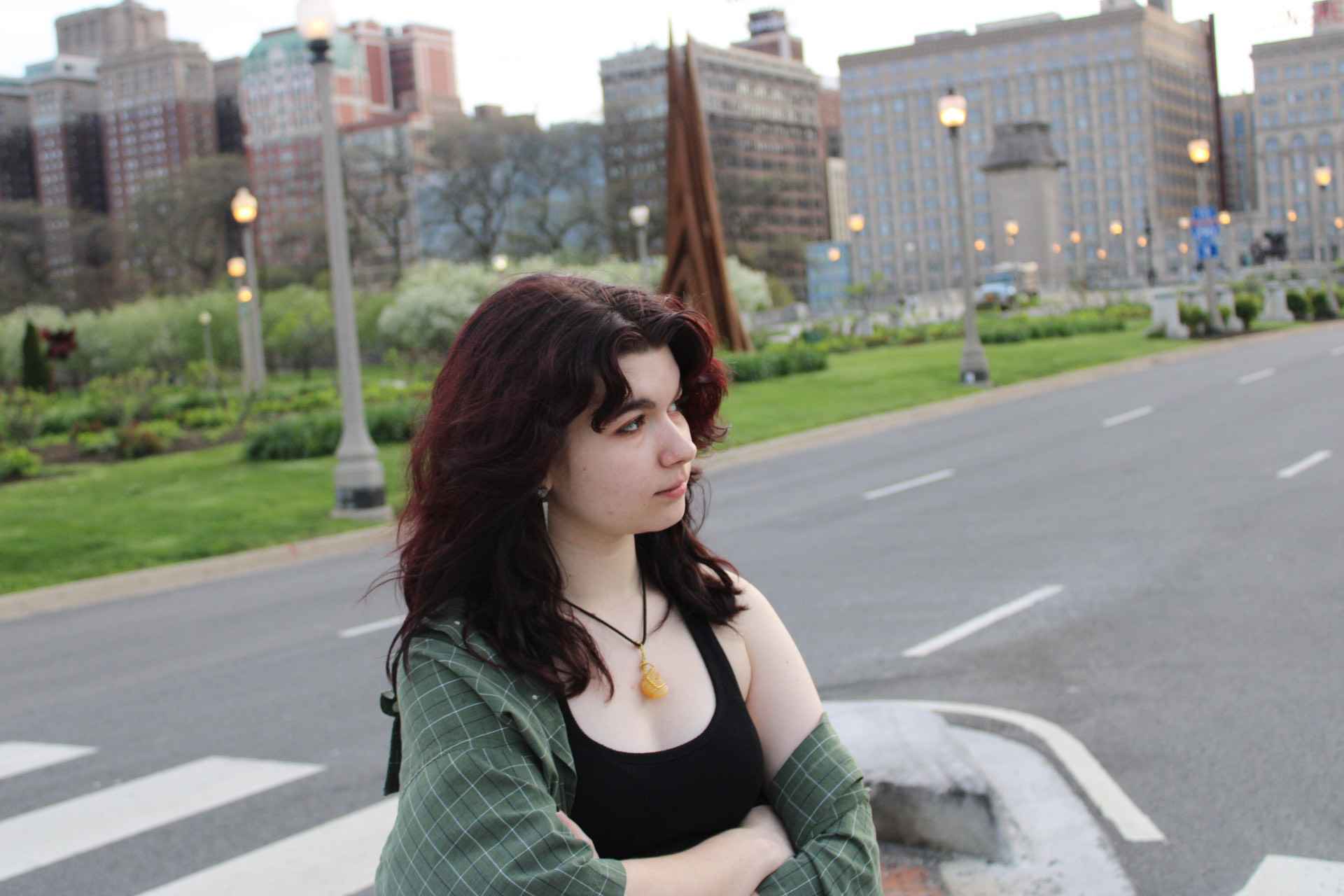 a picture of a woman with red hair standing in chicago