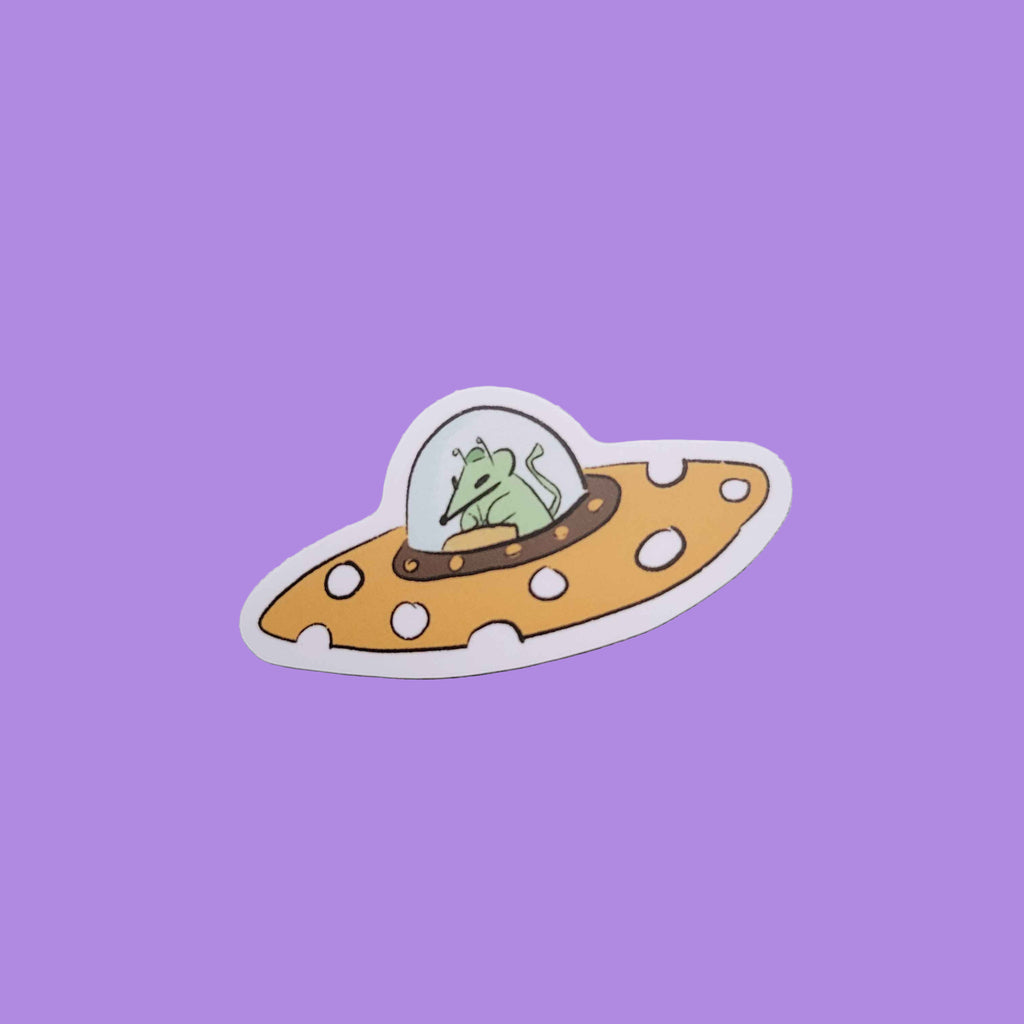 Sticker of a cartoon alien rat in a cheese UFO