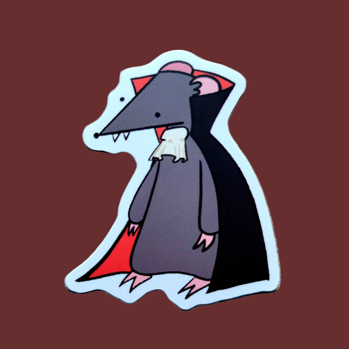 A sticker of a gray rat in a dracula costume
